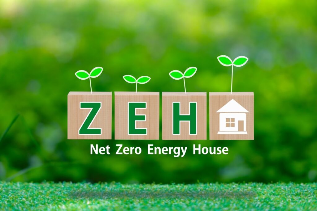 ZEHと書かれたキューブブロックと緑豊かな背景の画像